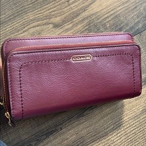Wine colored wristlet/clutch by Coach